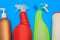 Plastic washing containers on a blue background for the cleaning the kitchen, bathroom. Detergents, bottles, various sizes and