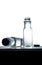 Plastic water bottle with black screw cap on the table and white background