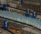 Plastic water bottles on conveyor and water bottling machine