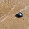 Plastic wheel in the sea sand