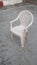 Plastic White chair on the ground beautiful white chair  Four legs