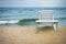 Plastic white lounge chair on empty beach