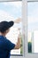 Plastic window installation wizard fastens glass with a rubber mallet