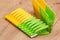 Plastic yellow and green clothespin