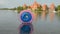 Plastic zorbing ball on lake water and Trakai castle