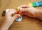 Plasticine in children`s hands, top view, close - up-the concept of creative activities in early childhood