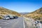 Plataforma de Gredos parking lot with cars and camper vans, Sierra de Gredos mountains, Spain.