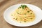 Plate AGLIO E OLIO on a tablecloth close-up