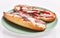 Plate of anchovies bread pizzas over white isolated background