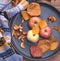 Plate with apples. Autumn layout. Fruit apples. Autumn picture. . Apples and autumn leaves