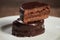 A plate with argentinean-uruguayan alfajores on a wooden table and dark background