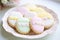 a plate of assorted easter biscuits with pastel icing