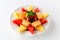 A plate of assorted fruit shaped into a star including watermelon, pineapple, cantaloupe, grapes, blackberries, strawberries,