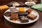 plate of assorted gourmet chocolate bars, each bar with unique flavor and presentation