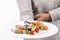 Plate with an assortment of nougat and other traditional sweets being held by an out of focus person