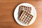 Plate of Belgian waffles wood