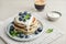 Plate blueberry pancakes with sour cream