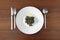 Plate of boiled spinach with olive oil