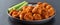 Plate of boneless chicken wings with buffalo sauce and celery sticks