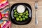 Plate with brussels sprouts, bowl of mayonnaise, napkin and fork