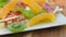 Plate of candied fruit kiwi, orange, watermelon, mango and pineapple