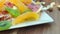 Plate of candied fruit kiwi, orange, watermelon, mango and pineapple