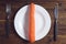 Plate with carrots, knife and fork