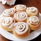 a plate of cinnamon rolls