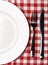 Plate at classic checkered tablecloth