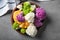 Plate with colorful cauliflowers on grey table