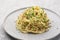 Plate with cooked classic Italian spaghetti aglio olio