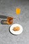 Plate with cookies, two glasses with refreshing drinks on the concrete surface