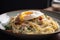 plate of creamy carbonara, with bacon and egg