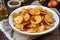 plate of crispy, salty potatoes chips with spicy seasoning