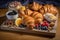 plate of croissants, with variety of pastries and confections for the eyes and tastebuds