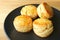 Plate of Delectable Homemade Candied Orange Zest Scones on Wooden Table