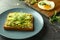 Plate with delicious avocado toast on table, closeup