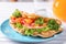 Plate with delicious bubble waffle on white wooden table, closeup