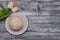 Plate with delicious doughnut with white Crea mIcing, and beautiful Tulip flowers on Rustic grey background with copy space for Te