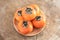 A plate of delicious red persimmons