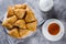 Plate with delicious samosas samsa with meat on gray background, top view. Uzbek food