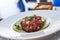 A plate of delicious tuna tartare with green apple