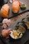 A plate of different combination of sushi with a bowl of soba