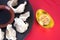 A plate of dumplings and gold ingots on a red background