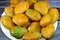 Plate of Egyptian fresh mango fruit with tropical delicacy, mangoes are nutritionally rich fruit with distinctive flavor, smell,