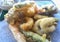 Plate of fish and battered and fried vegetables-
