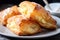 plate of flaky puff pastries filled with soft and creamy cheeses