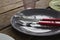 Plate with fork, butter knife and glass on wooden table