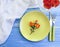 Plate, fork knife, rose flower anniversary romance elegance decoration holiday dinner on blue wooden background