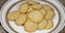 Plate of fresh almond cookies 24